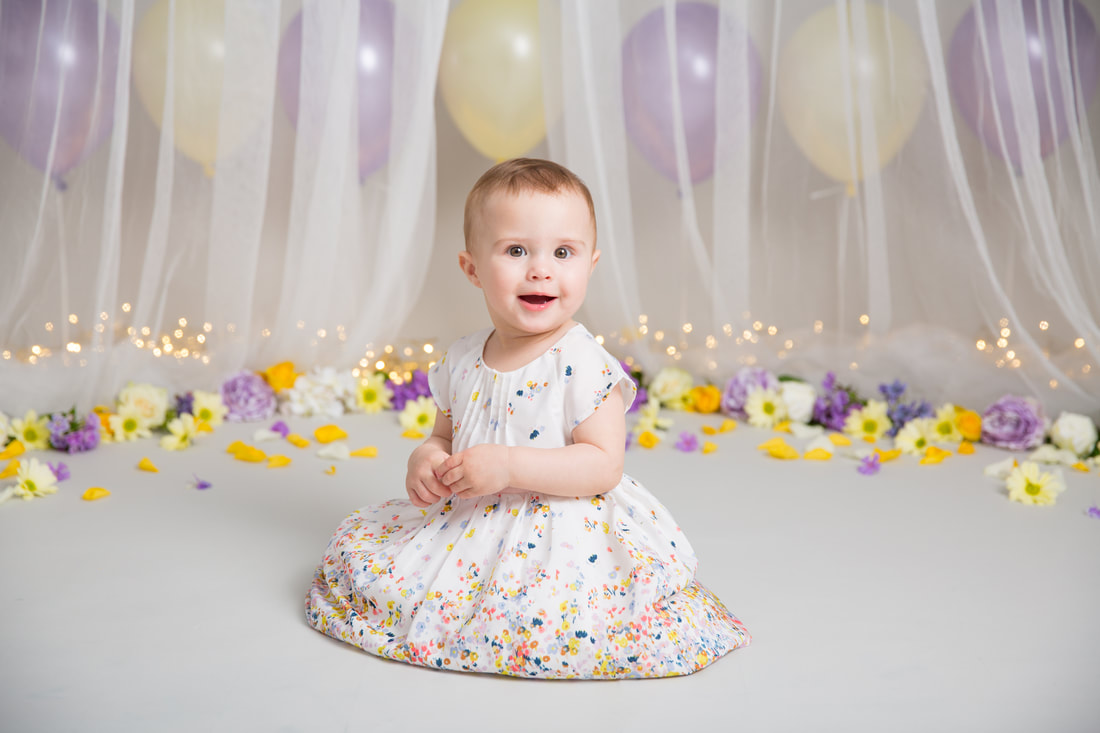 Clare Long photography cake smash purple flowers balloons first birthday london kent