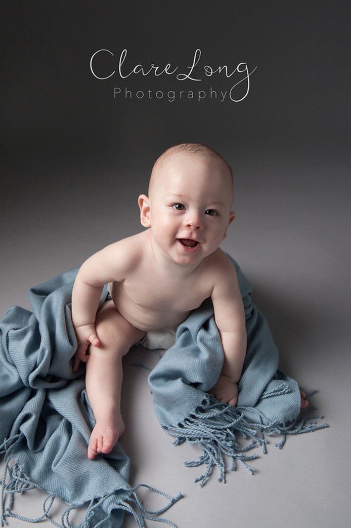 Clare Long Photography 6 months Baby sitting happy Photographer Kent 