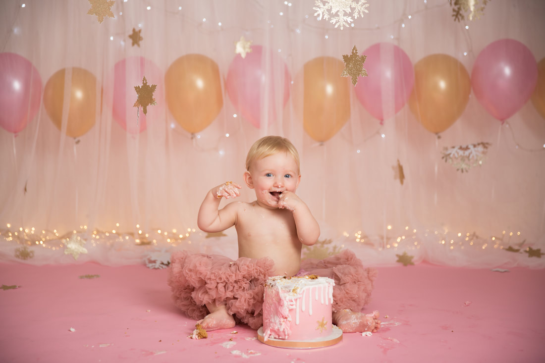 Clare Long photography cake smash pink snowflakes balloons first birthday london kent Picture
