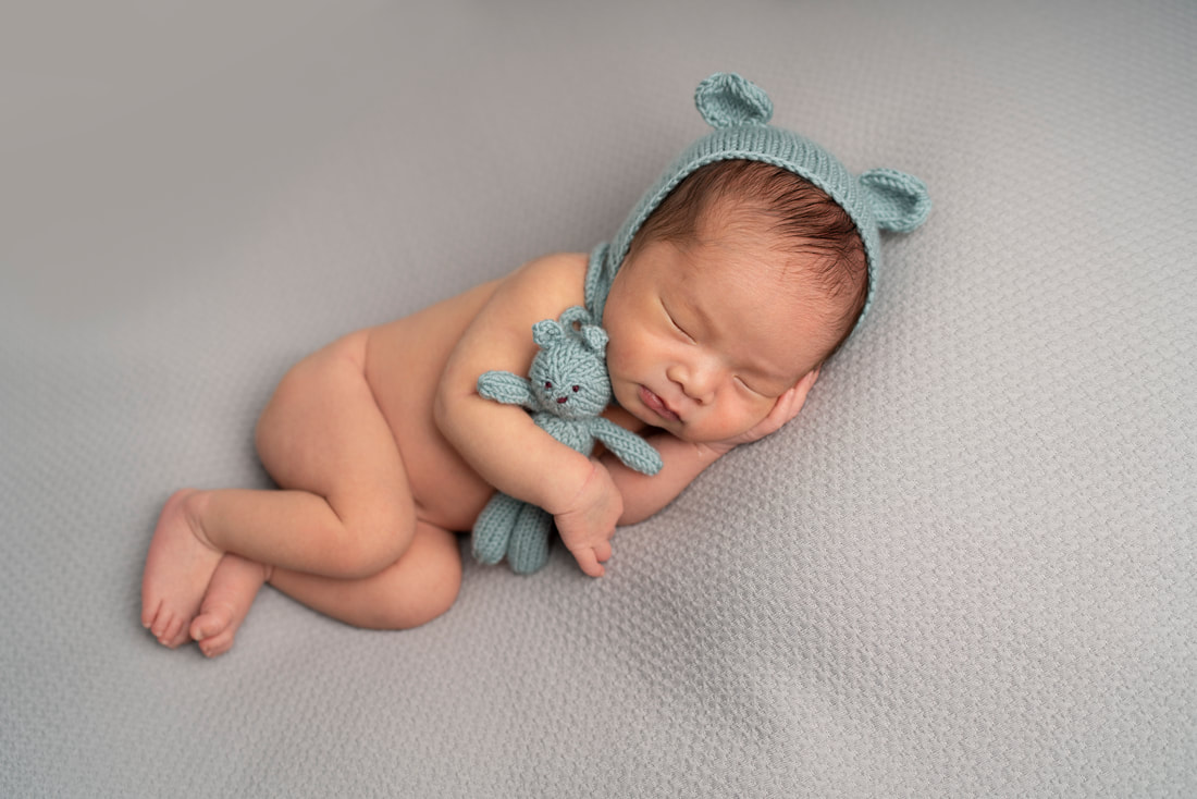 Baby boy sleeping with teddy simple newborn photography in Sidcup
