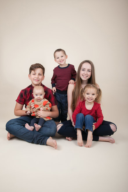 Family photographer London Clare Long Photography smiles cousins